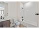 Bathroom featuring modern shower over tub, vanity, and patterned tile floors at 5741 Doc Bar Circle, Larkspur, CO 80118