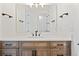 Bathroom vanity features wood cabinets, white countertop, and bronze fixtures at 5741 Doc Bar Circle, Larkspur, CO 80118