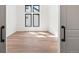 Empty bedroom features natural light and beautiful hardwood floors at 5741 Doc Bar Circle, Larkspur, CO 80118