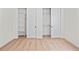 Bedroom closets with white sliding doors, shelving and hanging racks at 5741 Doc Bar Circle, Larkspur, CO 80118