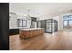 Spacious kitchen featuring an island, stainless steel appliances, modern lighting, and an open layout at 5741 Doc Bar Circle, Larkspur, CO 80118