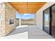 Covered outdoor patio features fireplace and scenic view at 5741 Doc Bar Circle, Larkspur, CO 80118