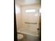 Bright bathroom with white tiled shower-tub and a grab bar for safety at 2090 S Hannibal Way # C, Aurora, CO 80013