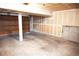 Spacious unfinished garage with concrete floor, exposed drywall, and a roll-up door at 2090 S Hannibal Way # C, Aurora, CO 80013