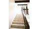 Bright staircase featuring carpeted steps, wooden beams and a skylight above at 2090 S Hannibal Way # C, Aurora, CO 80013