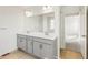 Double vanity bathroom with gray cabinets at 13352 E 110Th Way, Commerce City, CO 80022