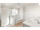 Bathroom boasts a soaking tub and double vanity at 13352 E 110Th Way, Commerce City, CO 80022