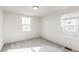 Spacious bedroom with neutral walls and carpet, featuring two windows at 13352 E 110Th Way, Commerce City, CO 80022