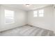 Bright bedroom with carpet and two windows at 13352 E 110Th Way, Commerce City, CO 80022