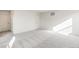 Spacious bedroom with carpet and a door at 13352 E 110Th Way, Commerce City, CO 80022