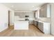 Spacious kitchen with gray cabinets, quartz countertops and an island at 13352 E 110Th Way, Commerce City, CO 80022