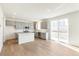 Modern kitchen with gray cabinets, island, and stainless steel appliances at 13352 E 110Th Way, Commerce City, CO 80022