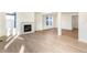 Living room with fireplace, hardwood floors and large windows at 13352 E 110Th Way, Commerce City, CO 80022