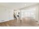 Bright living room with hardwood floors and staircase at 13352 E 110Th Way, Commerce City, CO 80022