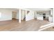 Open living room with hardwood floors and an open kitchen at 13352 E 110Th Way, Commerce City, CO 80022