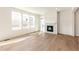 Living room with fireplace and hardwood floors, lots of natural light at 13352 E 110Th Way, Commerce City, CO 80022