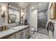 This bathroom offers a glass enclosed shower, marble countertops and brushed gold fixtures at 250 Sallie Barber Rd, Breckenridge, CO 80424