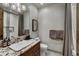 Modern bathroom features a granite countertop, decorative lighting, and a convenient shower with curtain at 250 Sallie Barber Rd, Breckenridge, CO 80424