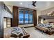 Spacious bedroom with bunkbeds and view of snow-covered mountains from the expansive windows at 250 Sallie Barber Rd, Breckenridge, CO 80424