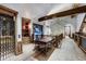 Hallway view of wood details, a stylish workstation and natural light from a picture window at 250 Sallie Barber Rd, Breckenridge, CO 80424