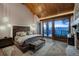 Main bedroom with vaulted wood ceiling and mountain views at 250 Sallie Barber Rd, Breckenridge, CO 80424