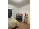 Bedroom with a TV and laminate wood floors; natural light coming in from the window at 47904 Dartmouth Ave, Bennett, CO 80102