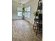 Sun-filled dining room featuring large windows, attractive flooring and modern decor at 47904 Dartmouth Ave, Bennett, CO 80102