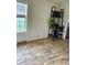 Sun-filled dining room featuring large windows, attractive flooring and rustic decor at 47904 Dartmouth Ave, Bennett, CO 80102
