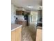 Bright kitchen featuring modern appliances, ample cabinet space and attractive flooring at 47904 Dartmouth Ave, Bennett, CO 80102