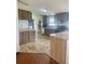 Spacious kitchen with plentiful cabinet space, modern appliances and attractive flooring at 47904 Dartmouth Ave, Bennett, CO 80102