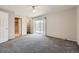 Spacious bedroom features a ceiling fan, closet, and outdoor access at 6727 S Race St, Centennial, CO 80122