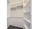 Walk-in closet featuring built-in shelving and ample storage space at 6727 S Race St, Centennial, CO 80122