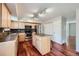 Kitchen with modern appliances, island, and tile backsplash at 6727 S Race St, Centennial, CO 80122