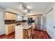 Well-lit kitchen featuring a central island, stainless steel appliances, and ample storage at 6727 S Race St, Centennial, CO 80122