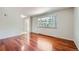 Inviting living room with gleaming hardwood floors and natural light at 6727 S Race St, Centennial, CO 80122