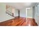 Bright living room featuring hardwood floors and staircase with modern design at 6727 S Race St, Centennial, CO 80122