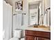 Bathroom with a cherry-stained vanity, framed artwork, and bronze fixtures at 6875 Northstar Ct, Castle Rock, CO 80108