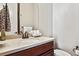 Tastefully designed half-bathroom featuring a vanity, bronze fixtures, and decorative touches at 6875 Northstar Ct, Castle Rock, CO 80108