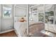 Cozy bedroom featuring a four-poster bed, window, and decor details in soft, neutral tones at 6875 Northstar Ct, Castle Rock, CO 80108