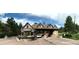 Stone gate with a manicured flower bed at the entry to a beautiful community at 6875 Northstar Ct, Castle Rock, CO 80108