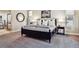 Bedroom features a neutral color scheme, soft lighting, a large bed, and views of the rock outcropping landscape at 6875 Northstar Ct, Castle Rock, CO 80108