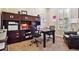 Cozy office space with built-in shelving, desk, and natural light from shuttered window at 6875 Northstar Ct, Castle Rock, CO 80108