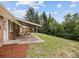 Lush backyard offers a serene escape with mature trees, patio, and ample space for recreation at 9120 W 3Rd Pl, Lakewood, CO 80226