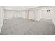 Large finished basement space with neutral carpet and freshly painted walls, ready for customization at 9120 W 3Rd Pl, Lakewood, CO 80226