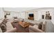 Staged basement space with neutral carpet, furniture, and painted walls creating a welcoming living area at 9120 W 3Rd Pl, Lakewood, CO 80226
