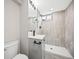 Modern bathroom featuring a stand-up shower, floating vanity, and sleek fixtures for a spa-like feel at 9120 W 3Rd Pl, Lakewood, CO 80226
