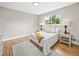 Bright bedroom featuring hardwood floors, neutral walls, and two windows for ample natural light at 9120 W 3Rd Pl, Lakewood, CO 80226