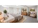 Bright bedroom featuring a wooden bed frame, cozy furniture, and neutral tones throughout at 9120 W 3Rd Pl, Lakewood, CO 80226