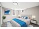 Serene bedroom featuring a plush bed, contemporary decor, and ample natural light at 9120 W 3Rd Pl, Lakewood, CO 80226