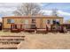 Backyard featuring a wooden deck with seating and a garden area, great for outdoor enjoyment at 8881 Judson St, Westminster, CO 80031